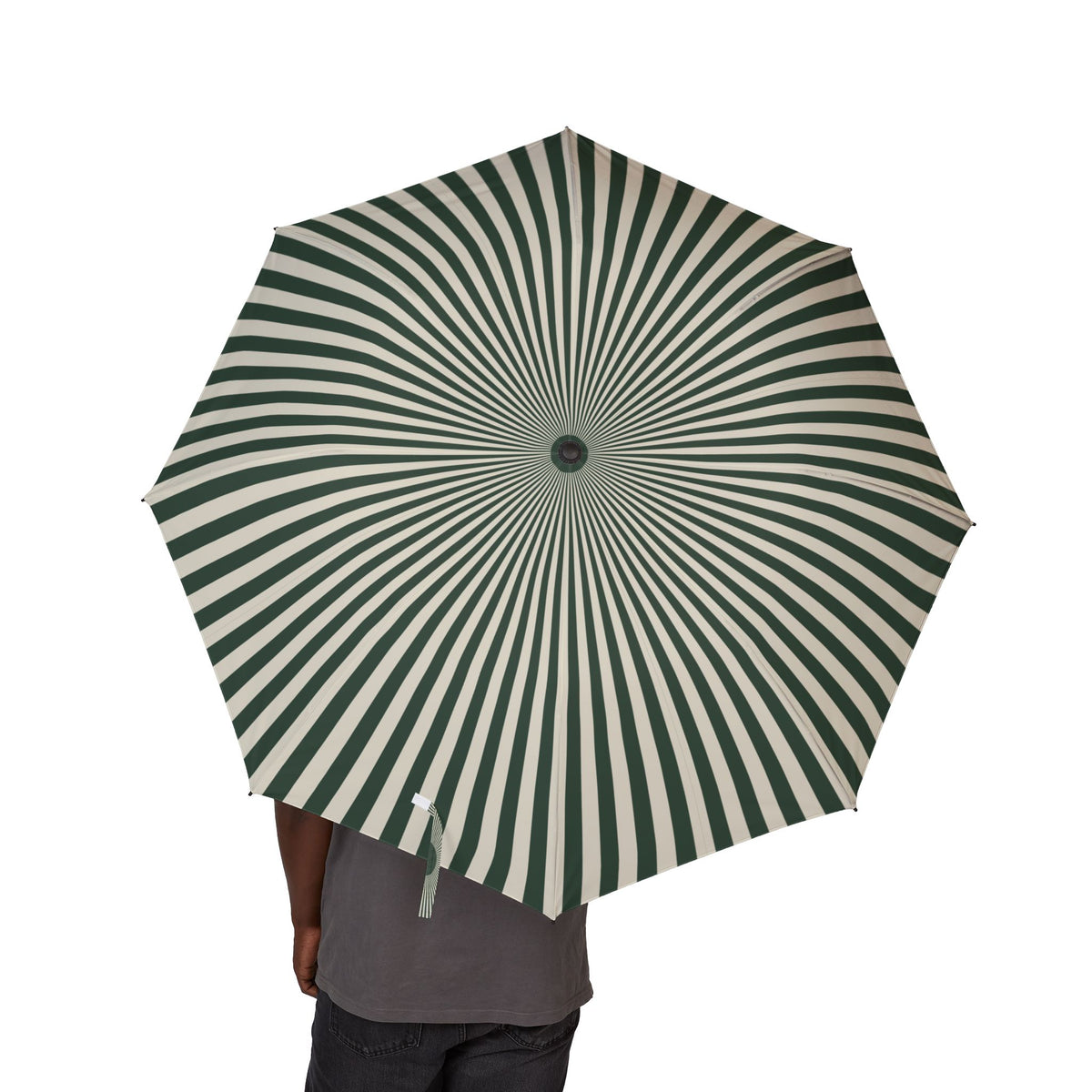 Person holding the Lancaster sunray stripe folding umbrella, canopy from above