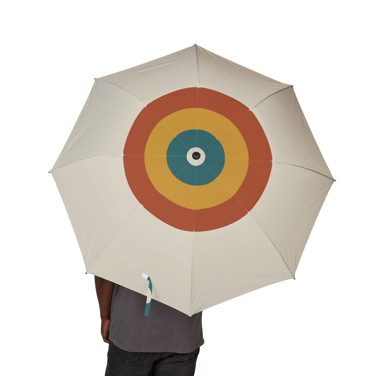 Person holding the Hamilton Bauhaus target folding umbrella, canopy from above