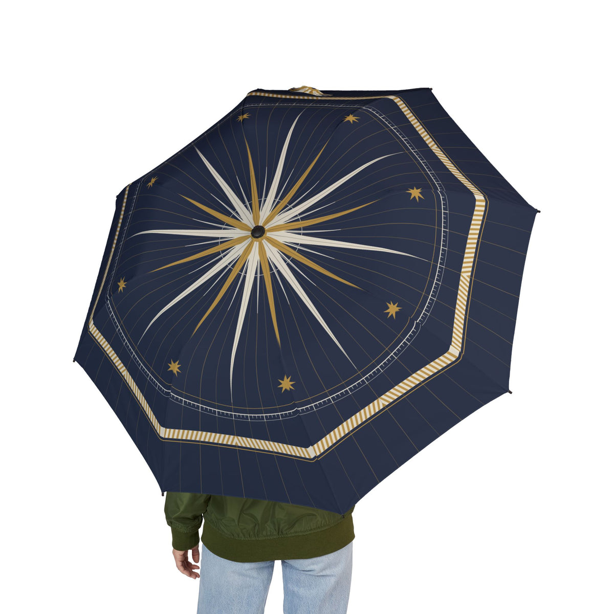 Person holding the Grimaldi compass rose folding umbrella, seen from behind