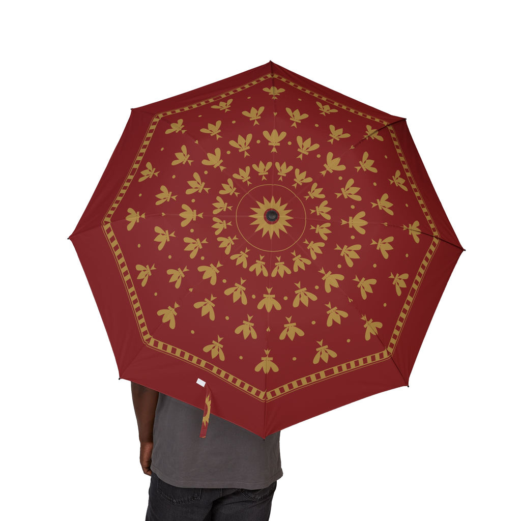 Person holding the Plantagenet fleur-de-lis folding umbrella, canopy from above