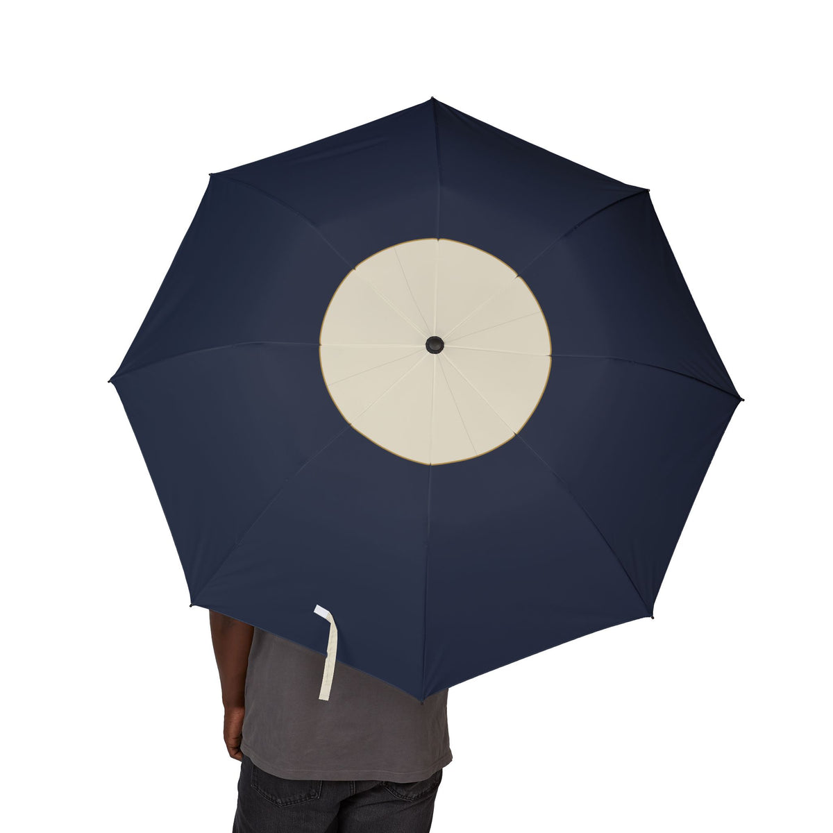 Person holding the Clifford cream crown folding umbrella, canopy from above