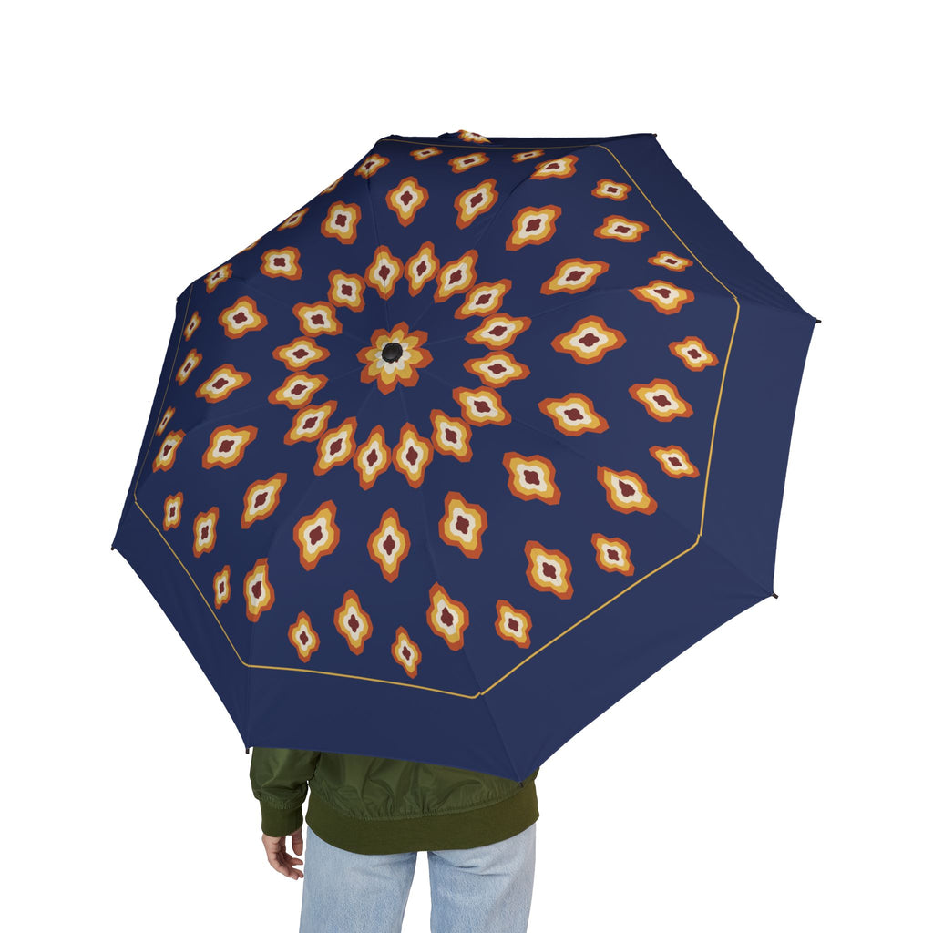 Person holding the Durrani ikat diamond folding umbrella, seen from behind