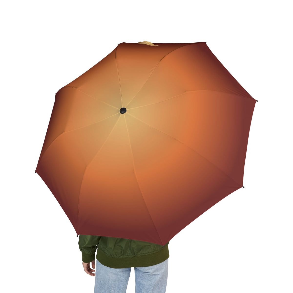 Person holding the Grosvenor golden hour folding umbrella, seen from behind