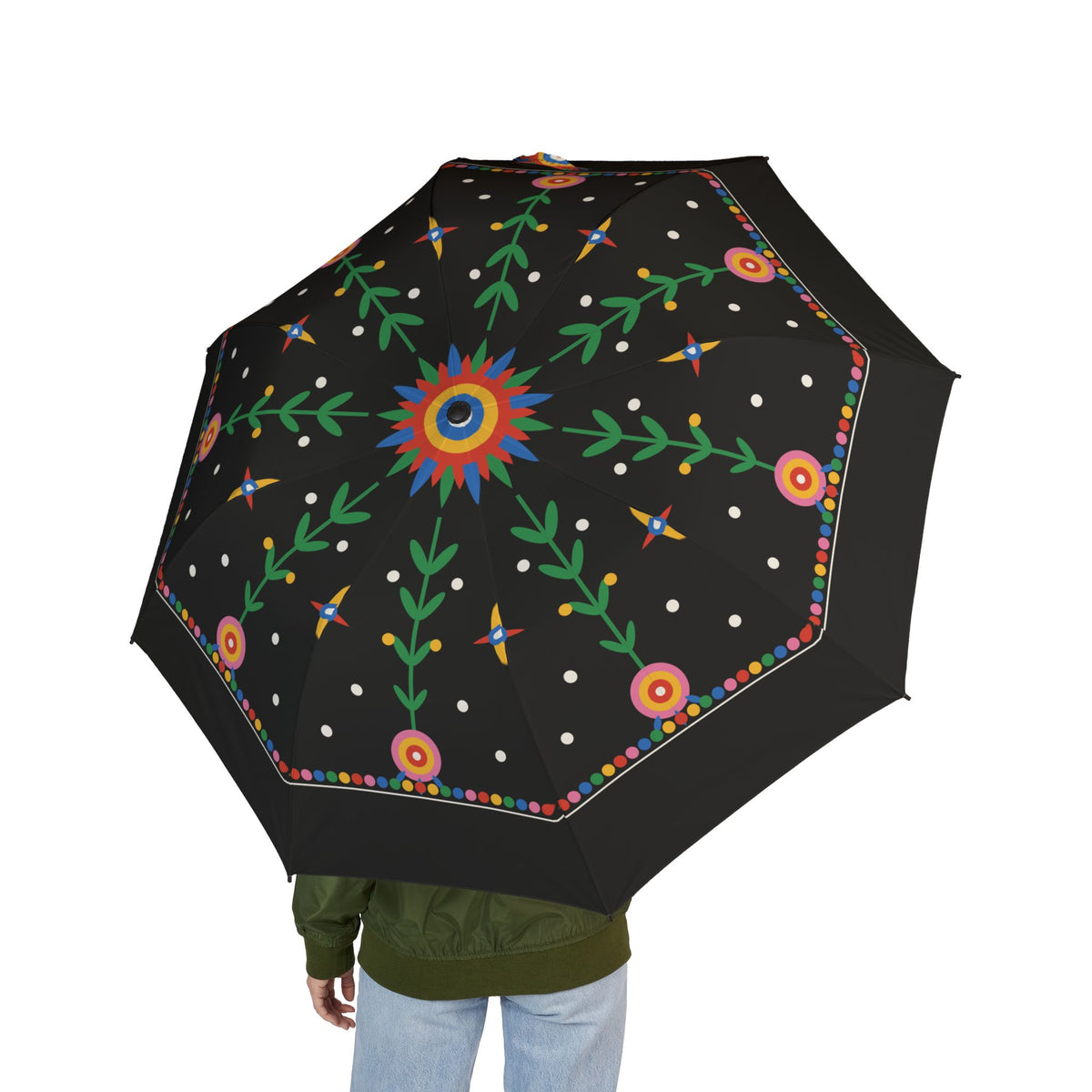 Person holding the Jagiellon folk paper-cut folding umbrella, seen from behind