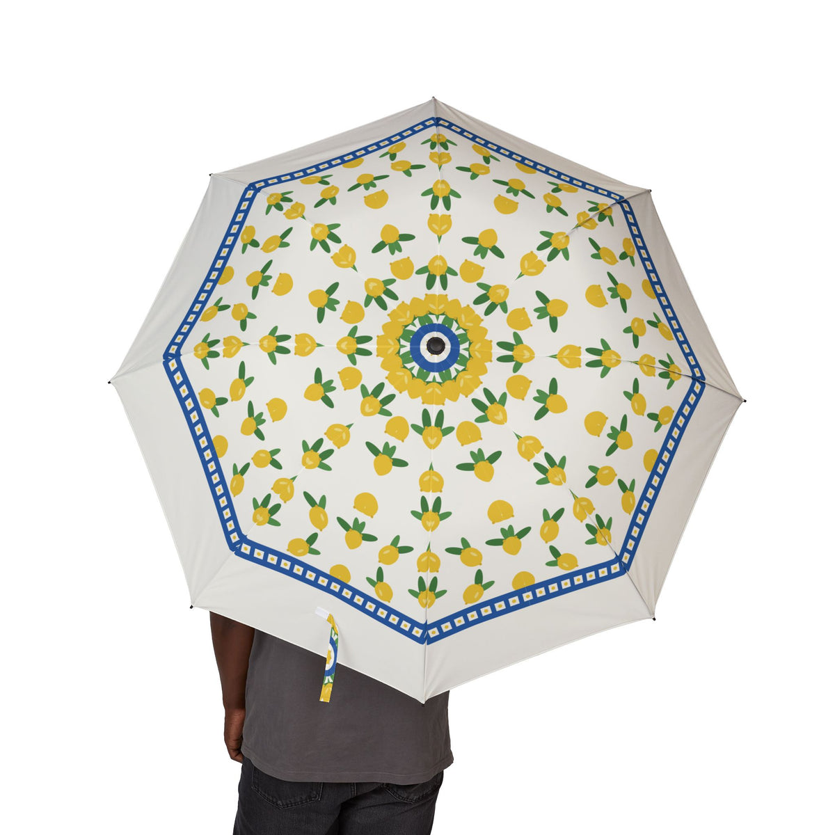 Person holding the Caracciolo Amalfi lemon folding umbrella, canopy from above