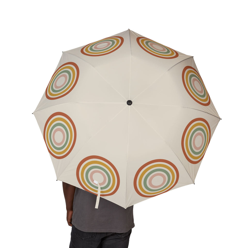 Person holding the Fiennes boho arch folding umbrella, canopy from above
