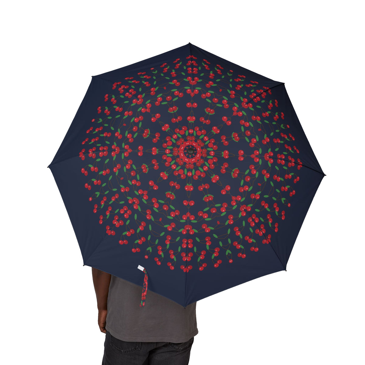 Person holding the Kinsky cherry folding umbrella, canopy from above