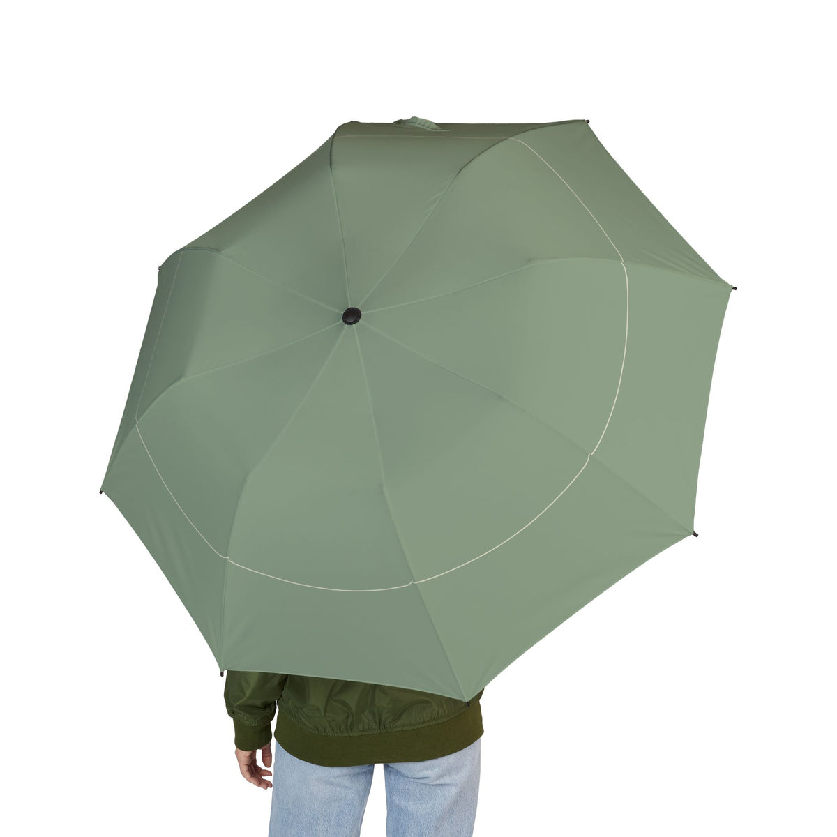 Person holding the Mortimer sage hairline folding umbrella, seen from behind