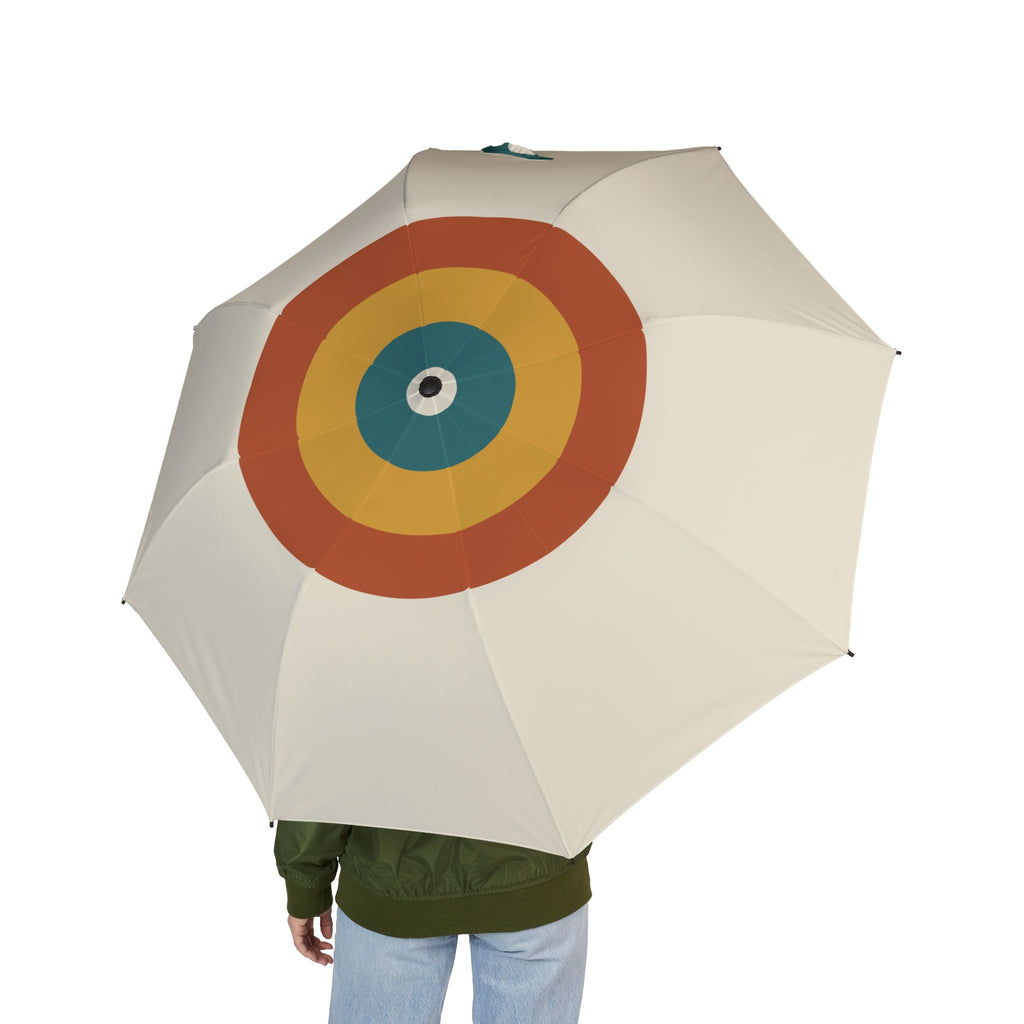 Person holding the Hamilton Bauhaus target folding umbrella, seen from behind