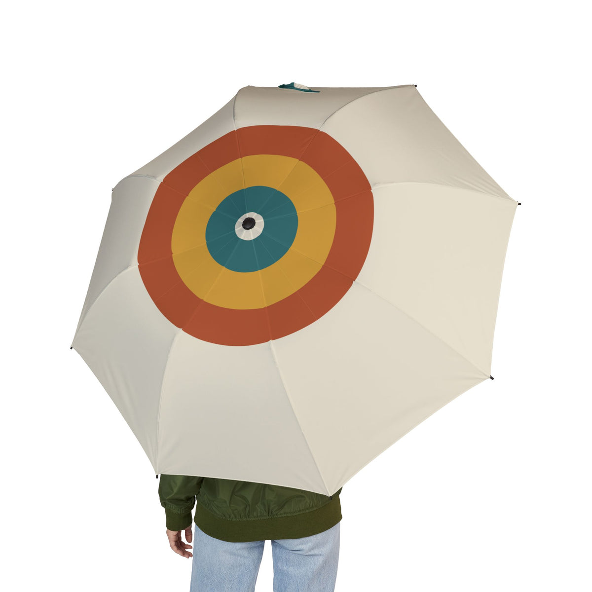 Person holding the Hamilton Bauhaus target folding umbrella, seen from behind