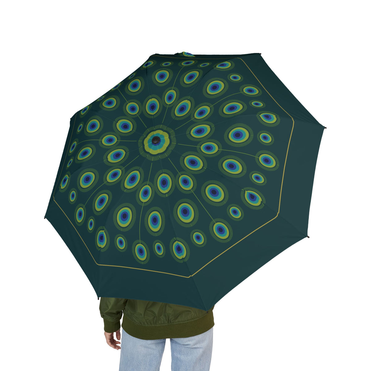 Person holding the Orléans peacock feather folding umbrella, seen from behind
