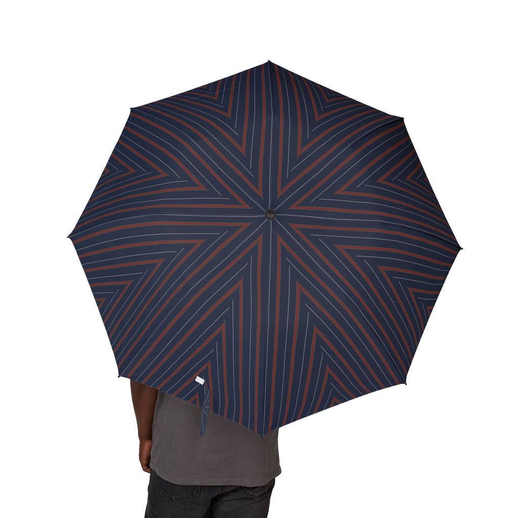 Person holding the Villeroy club stripe folding umbrella, canopy from above