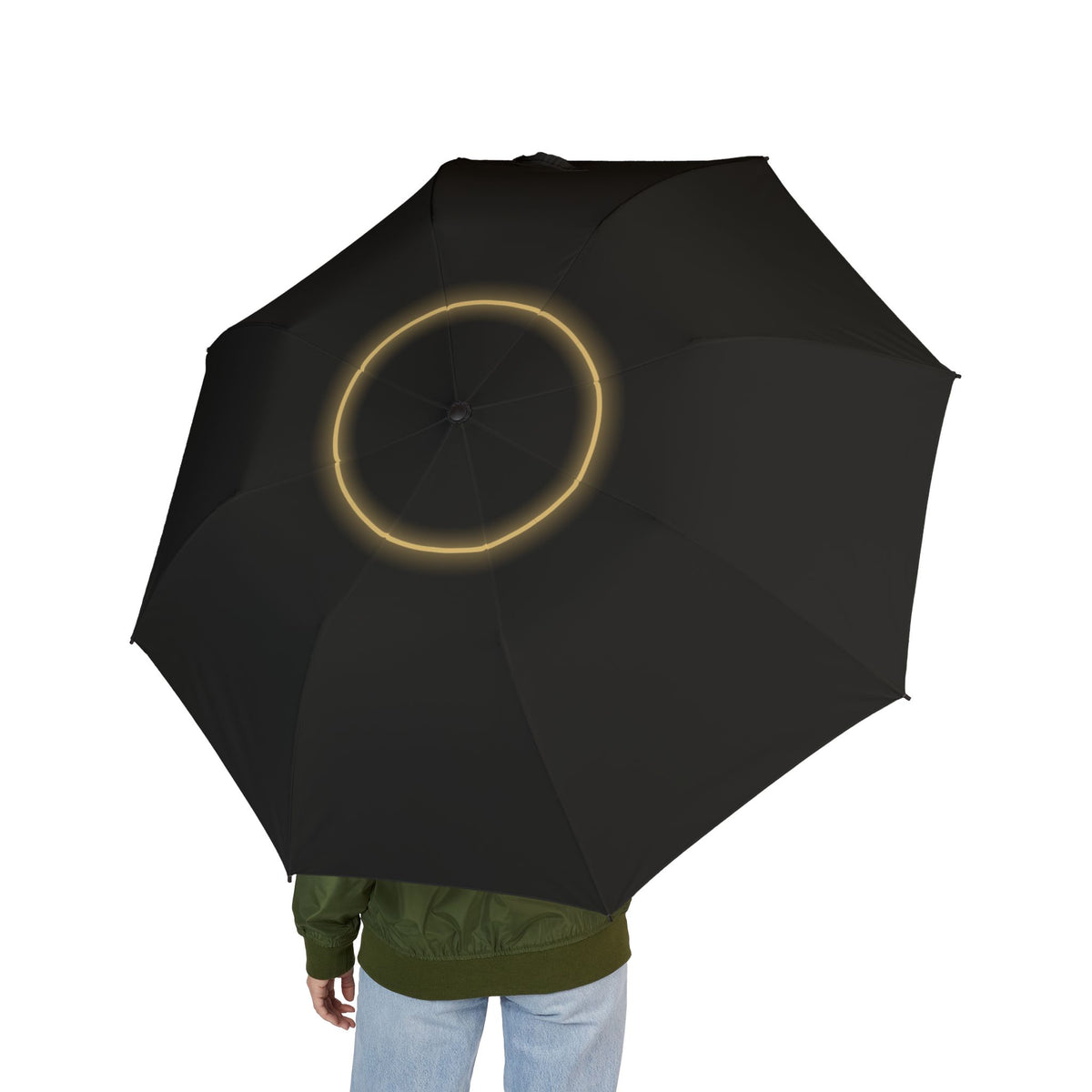 Person holding the Radziwiłł eclipse folding umbrella, seen from behind