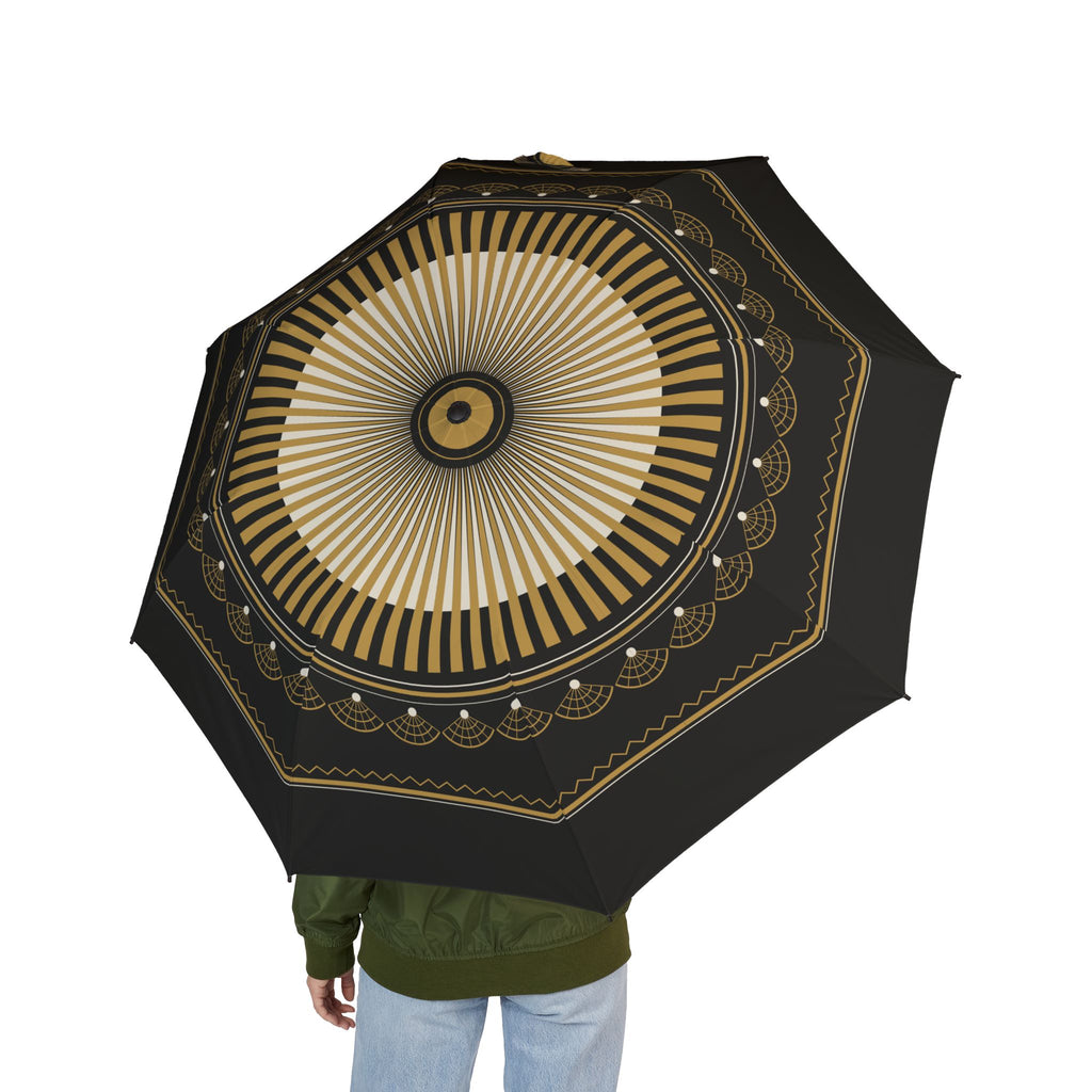 Person holding the Bourbon art deco sunburst folding umbrella, seen from behind