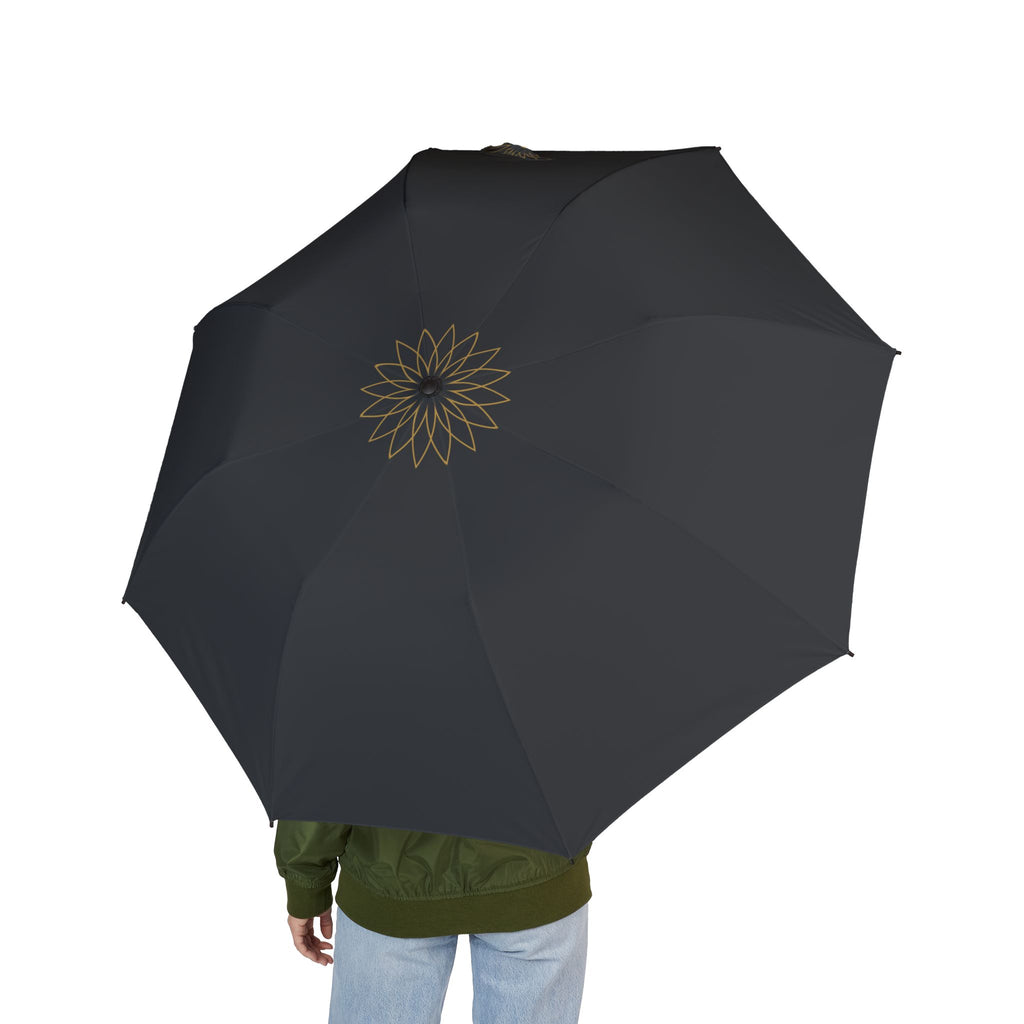 Person holding the Stafford gold rosette folding umbrella, seen from behind