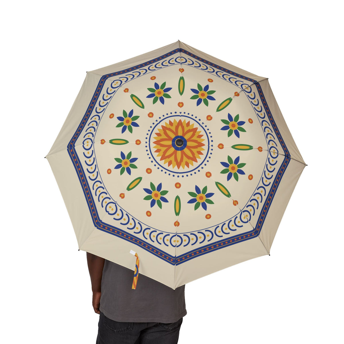 Person holding the Trastámara Talavera tile folding umbrella, canopy from above