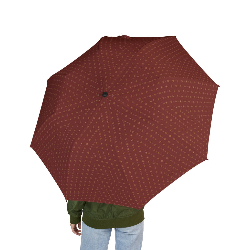 Person holding the Vendôme foulard folding umbrella, seen from behind