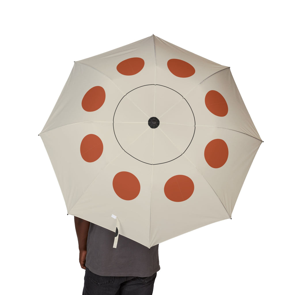 Person holding the Lennox Bauhaus dot folding umbrella, canopy from above
