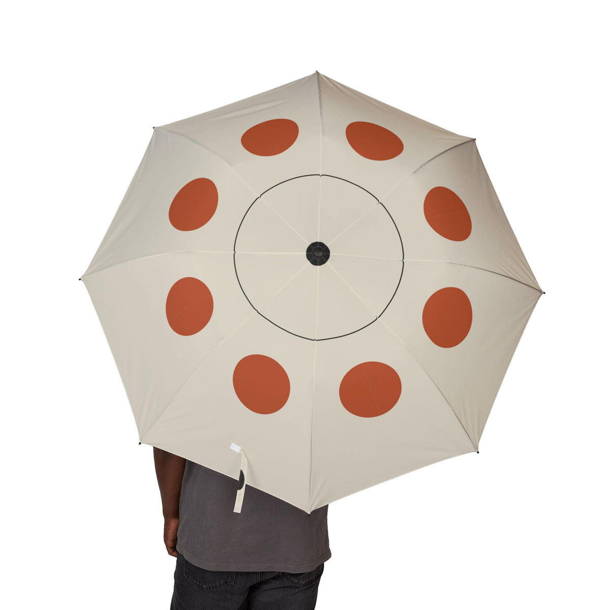 Person holding the Lennox Bauhaus dot folding umbrella, canopy from above