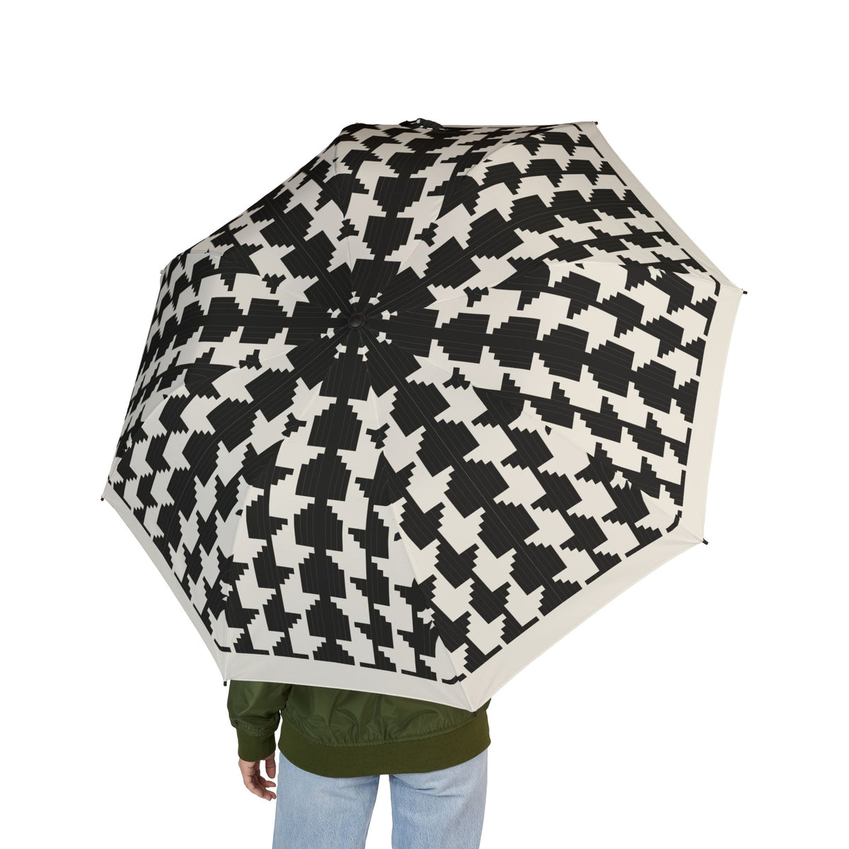 Person holding the Bernadotte houndstooth folding umbrella, seen from behind