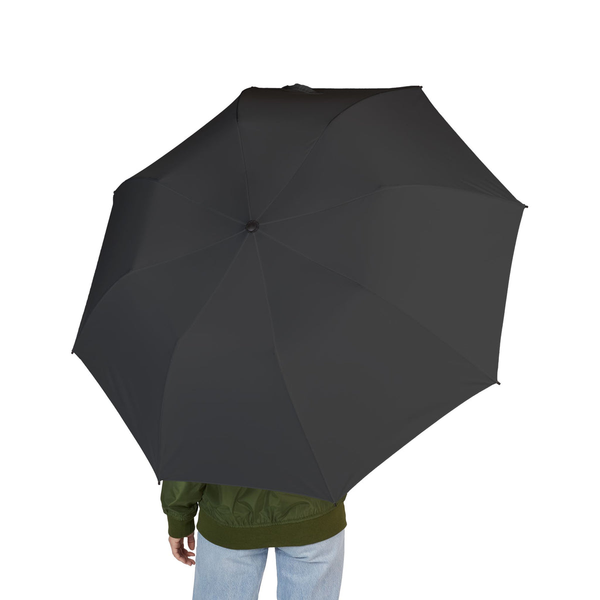 Person holding The Beaufort charcoal folding umbrella, seen from behind