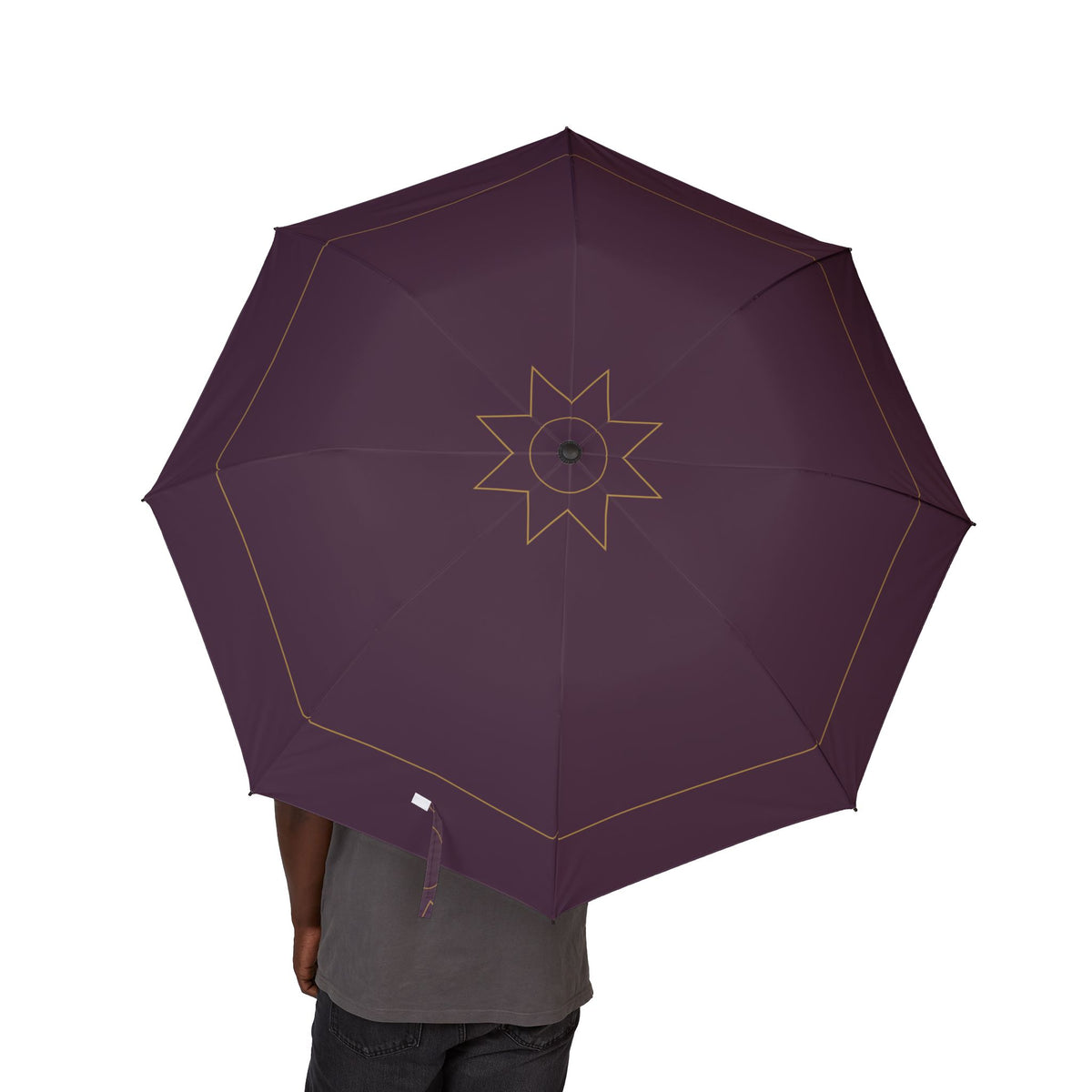 Person holding the Neville plum gold-rosette folding umbrella, canopy from above