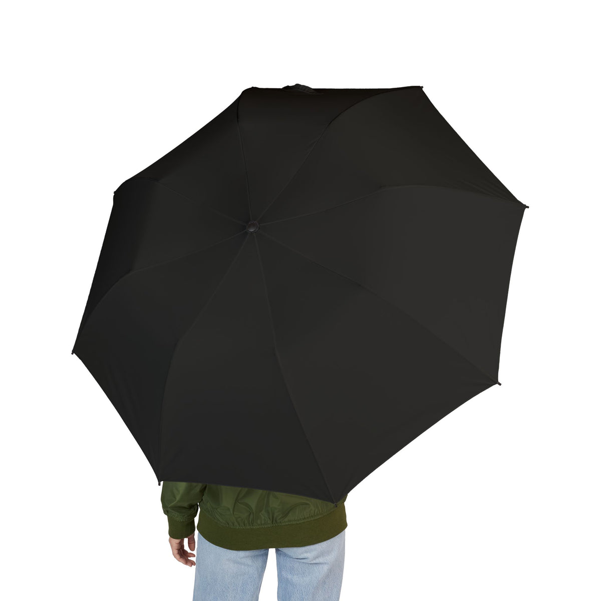 Person holding The Montmorency ink black folding umbrella, seen from behind