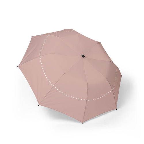 The Ashley blush pearl folding umbrella, open, seen from above