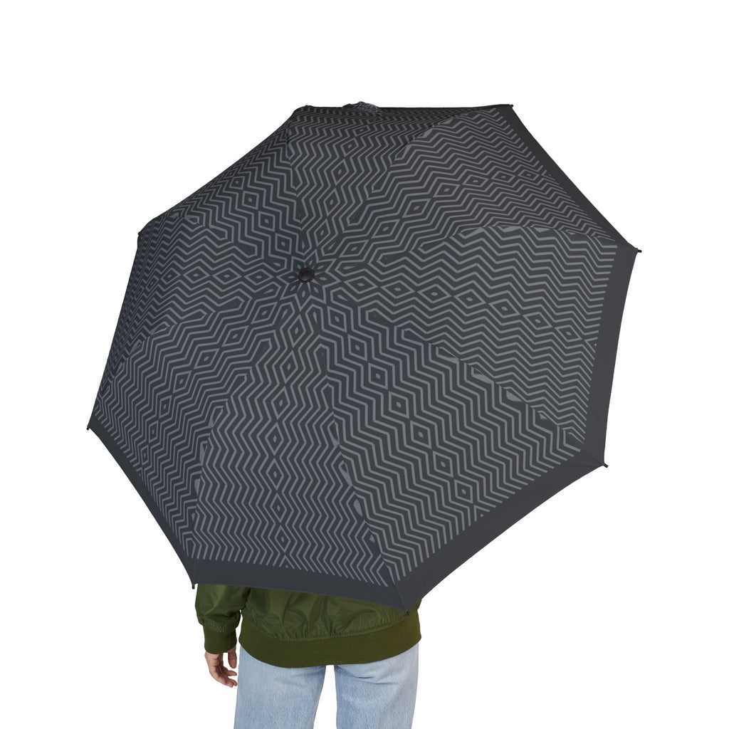 Person holding the Coburg herringbone folding umbrella, seen from behind