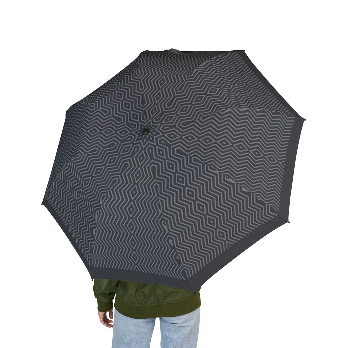 Person holding the Coburg herringbone folding umbrella, seen from behind