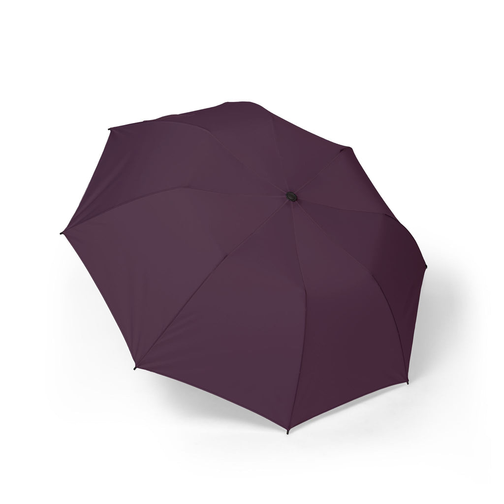 The Montefeltro solid plum folding umbrella, open, seen from above