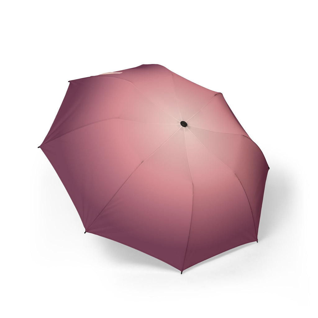 The Rothschild blush ombré folding umbrella, open, seen from above