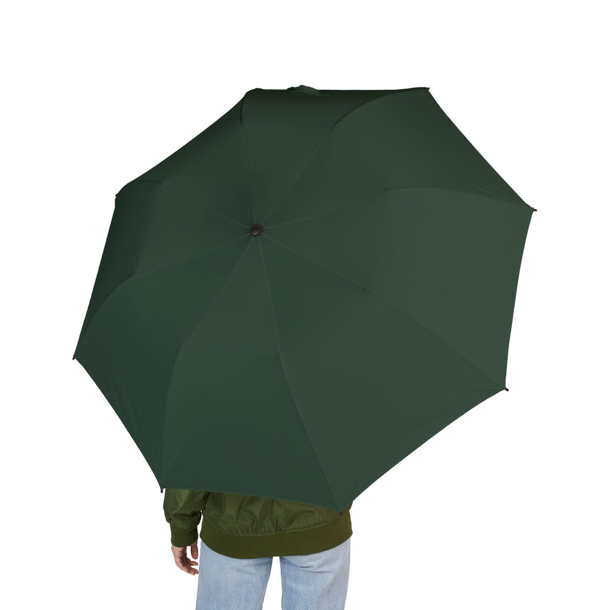 Person holding The Talbot bottle green folding umbrella, seen from behind