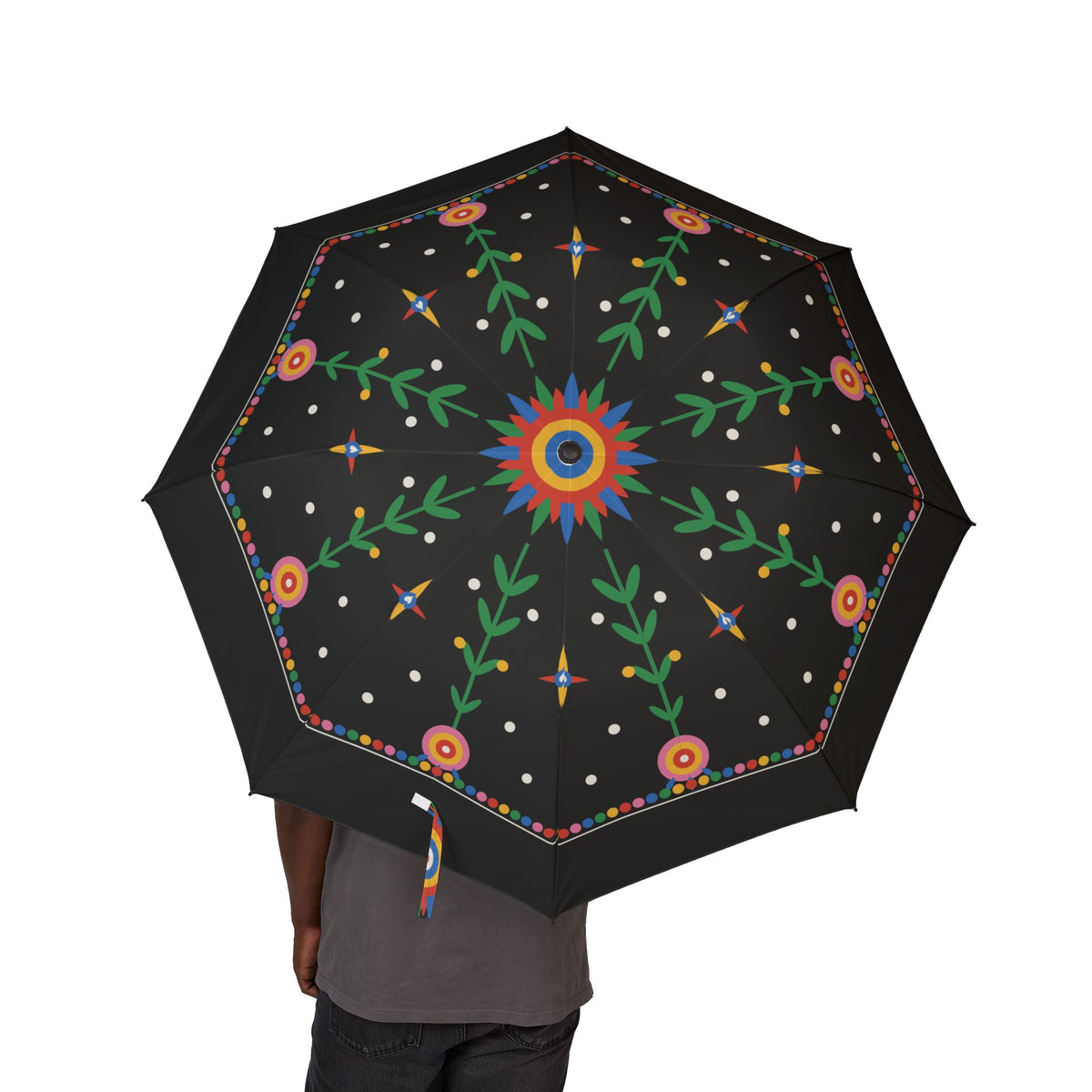 Person holding the Jagiellon folk paper-cut folding umbrella, canopy from above
