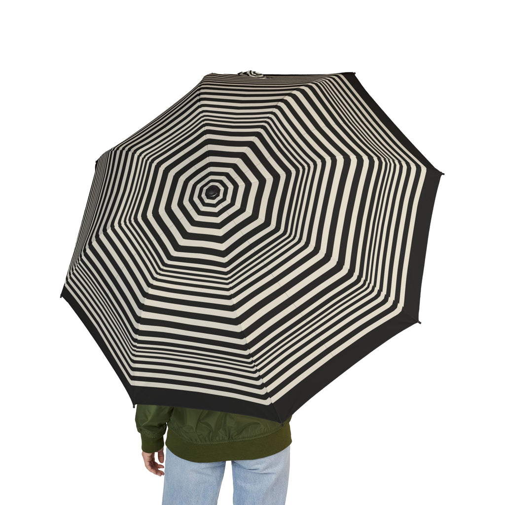 Person holding the Lobkowicz op-art folding umbrella, seen from behind