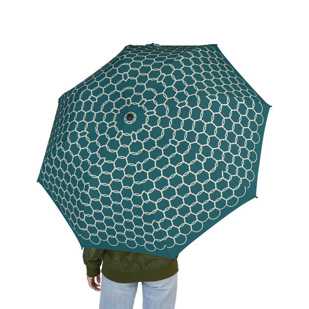 Person holding the Saadi Moroccan lattice folding umbrella, seen from behind