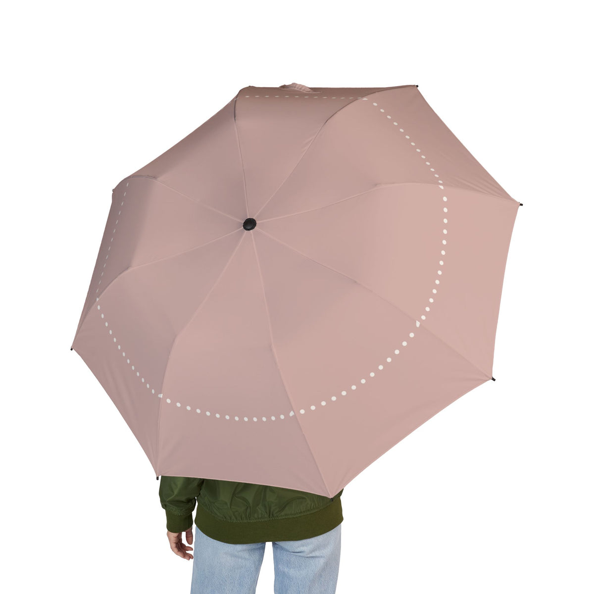 Person holding the Ashley blush pearl folding umbrella, seen from behind