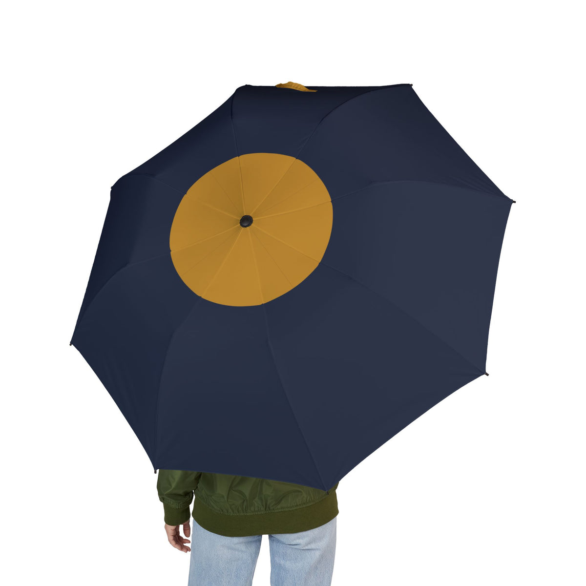 Person holding the Russell sun spot folding umbrella, seen from behind