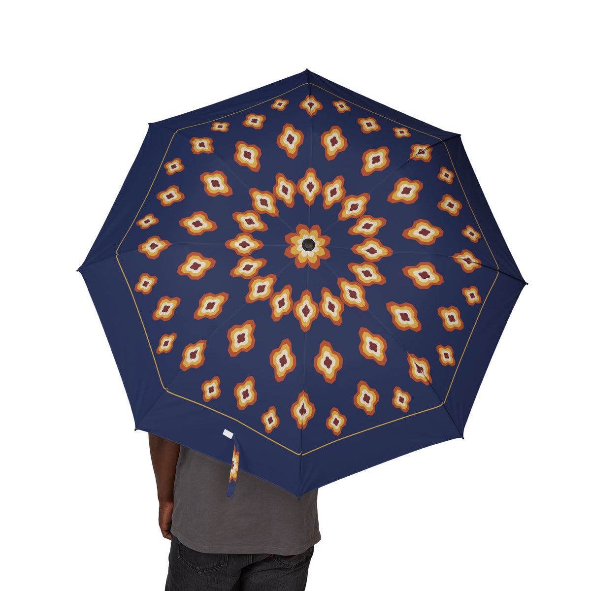 Person holding the Durrani ikat diamond folding umbrella, canopy from above