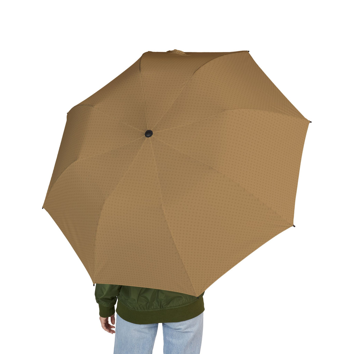 Person holding the Braganza camel tonal quatrefoil folding umbrella, seen from behind