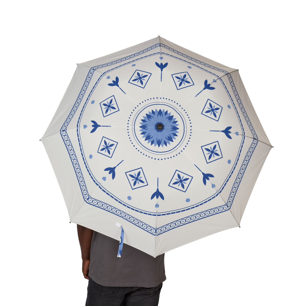 Person holding the Orange-Nassau Delft blue folding umbrella, canopy from above
