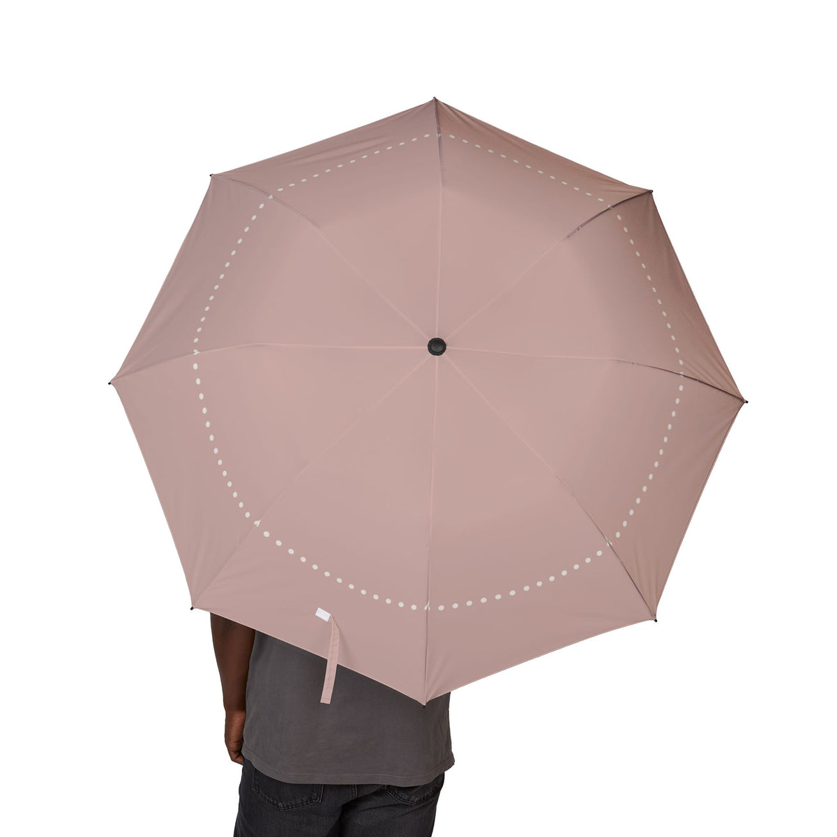Person holding the Ashley blush pearl folding umbrella, canopy from above