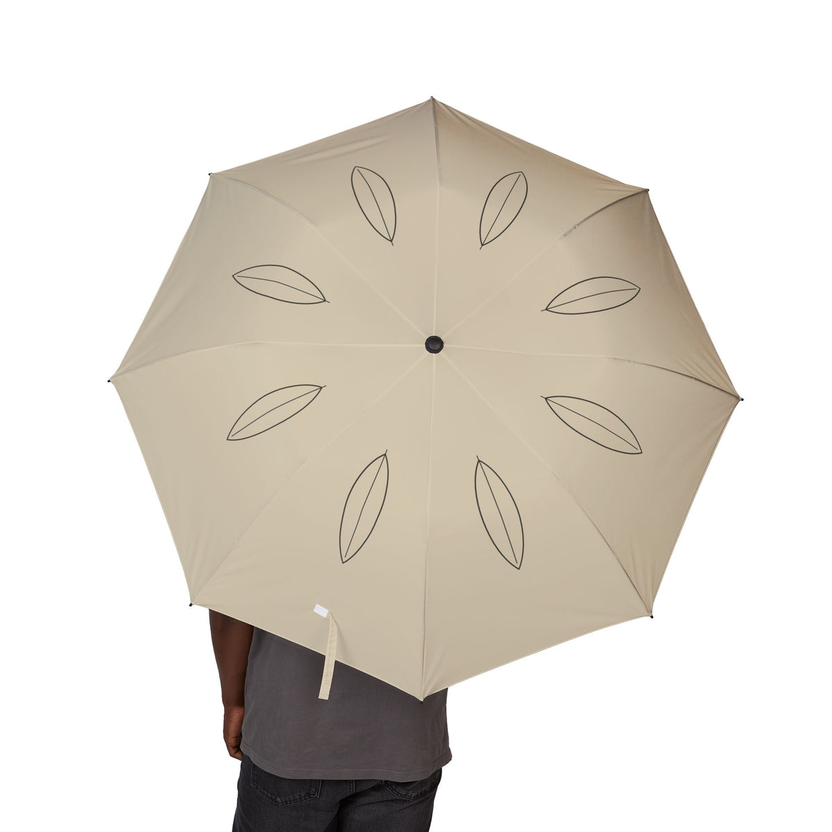 Person holding the Montagu single leaf folding umbrella, canopy from above