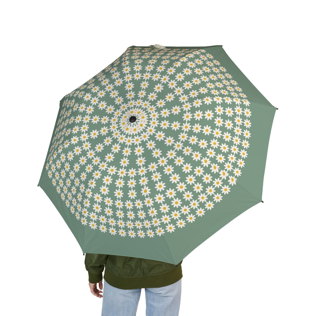 Person holding the Liechtenstein daisy field folding umbrella, seen from behind