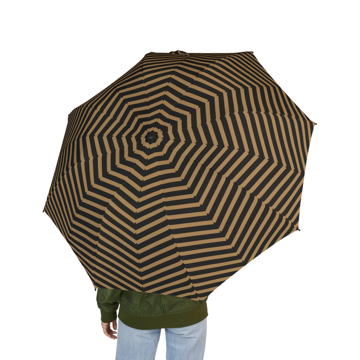 Person holding the Cavendish arrow chevron folding umbrella, seen from behind