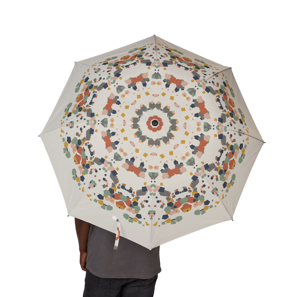 Person holding the Medinaceli terrazzo folding umbrella, canopy from above