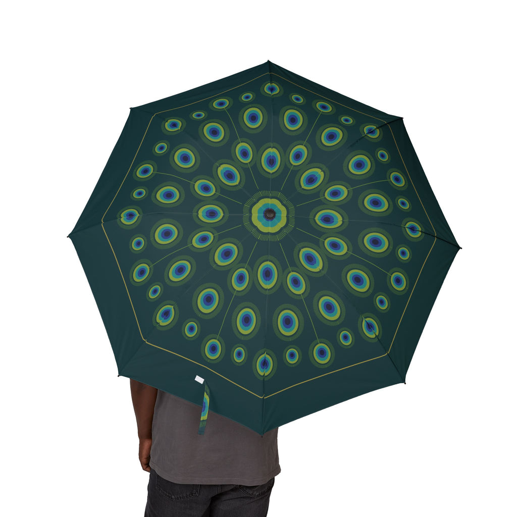 Person holding the Orléans peacock feather folding umbrella, canopy from above