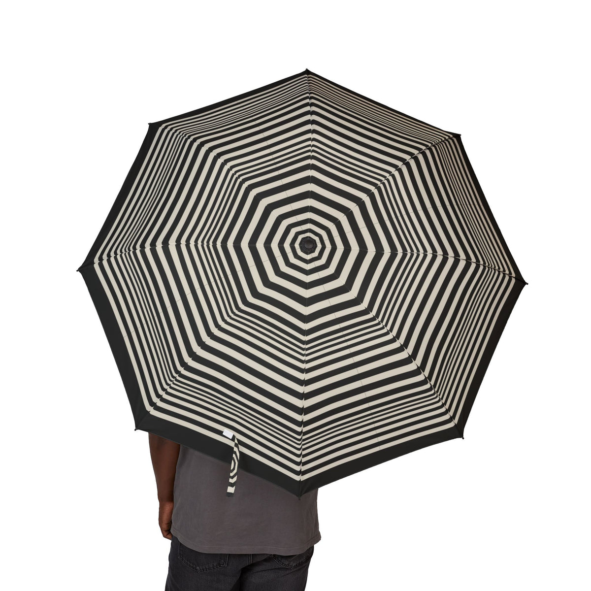 Person holding the Lobkowicz op-art folding umbrella, canopy from above