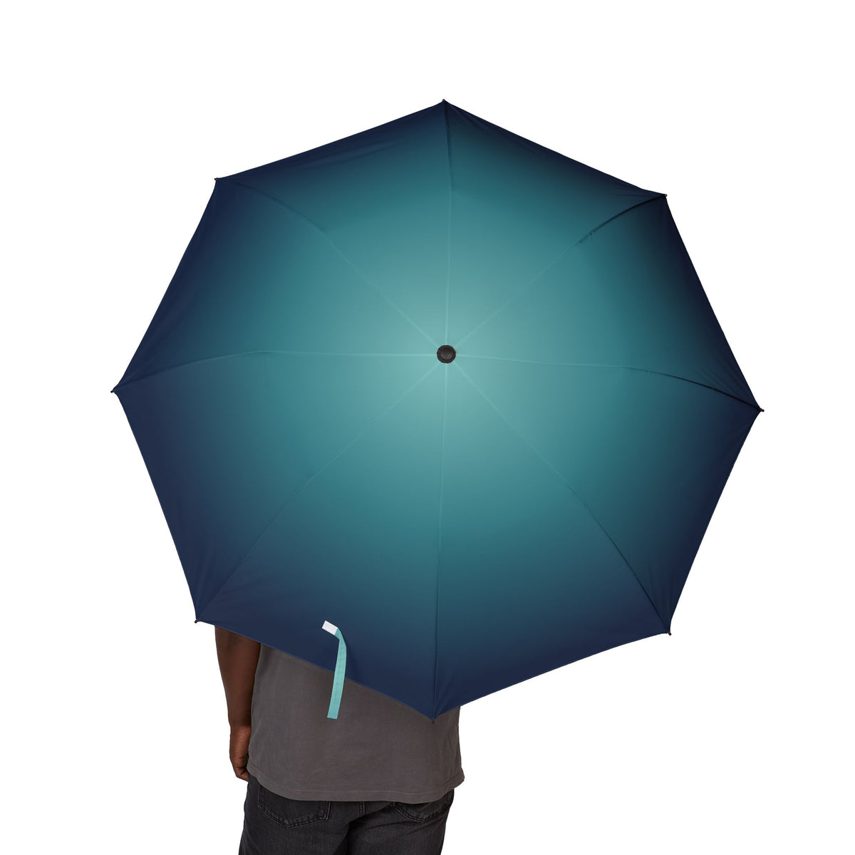 Person holding the Wellesley ocean ombré folding umbrella, canopy from above