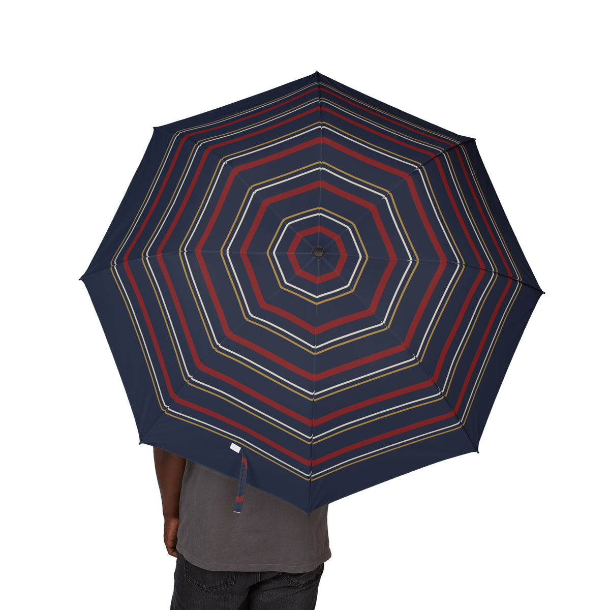 Person holding the Tudor octagon regimental folding umbrella, canopy from above